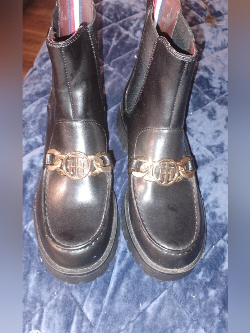 Tommy Hilfiger Black Leather Chelsea Lug Booties with Gold Chain Emblem